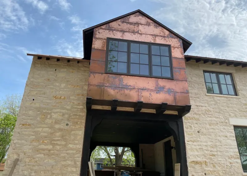 Copper metal panel facade on a stone building for Metal Roof Coating in McCandless